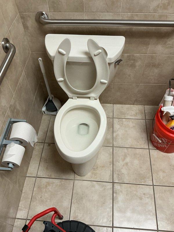 Responded to clogged toilet with poor flushing performance. Upon inspection, discovered soap bottle lodged in the P-trap causing the obstruction. Removed toilet from floor flange, extracted the foreign object from the trap, and reinstalled toilet with proper seal to restore full functionality.