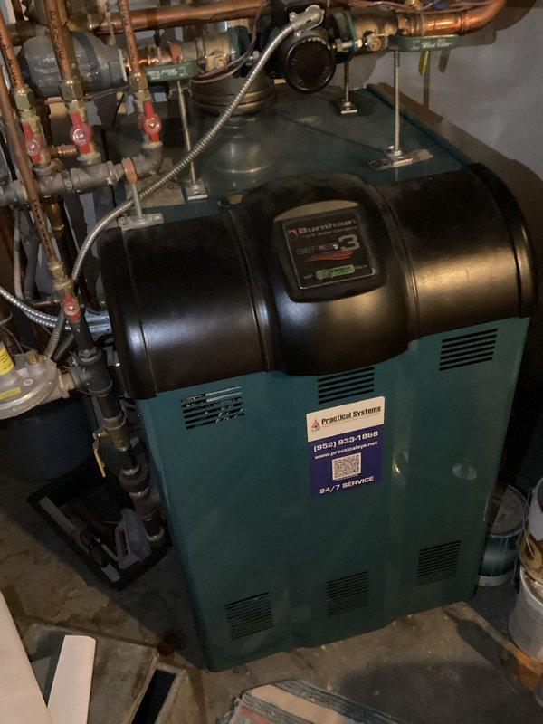 Completed routine heating system maintenance on Trane unit as part of preventative maintenance agreement. Performed comprehensive tune-up inspection of boiler system, including examination of Burnham boiler unit, expansion tank, circulation pump, hydronic piping manifold, and associated valves and controls. Verified proper operation of all heating components, checked electrical breaker panel connections, inspected copper piping distribution system with ball valves, confirmed pressure gauge readings within normal parameters, and ensured all safety controls functioning correctly with no issues identified.