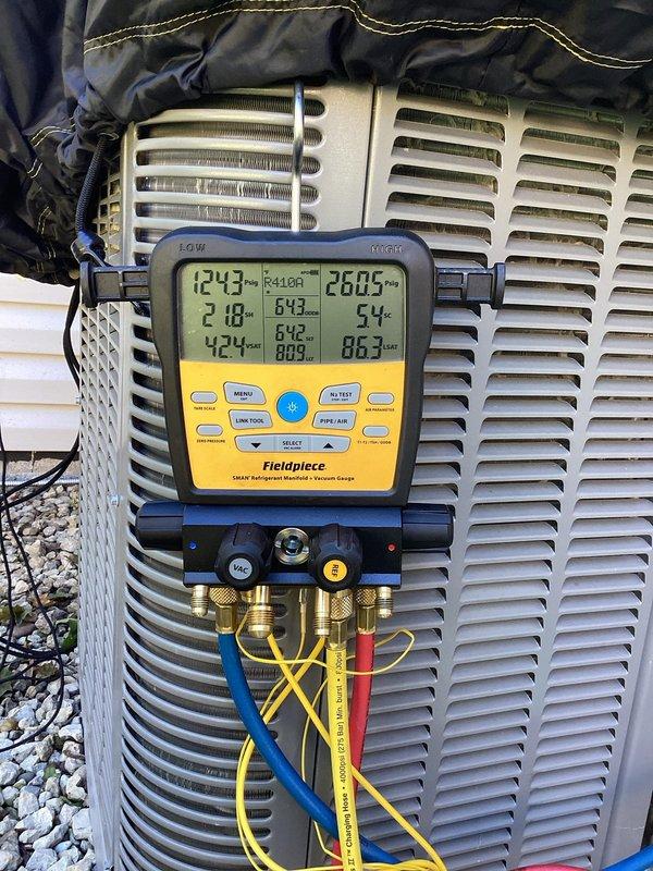 Responded to service call for air conditioning system requiring refrigerant. Upon inspection, system was found to be low on R410A refrigerant. Added two pounds of R410A refrigerant from stock to bring system to proper charge levels. Verified proper system operation and confirmed refrigerant charge is now within manufacturer specifications using diagnostic gauges.