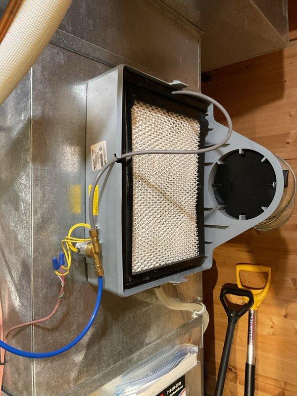 Performed comprehensive maintenance on four-year-old Lennox EL296 furnace including verification of gas pressure and temperature rise within specifications, flame sensor cleaning, electrical terminal tightening, and condensate trap flushing with 40 oz of water. Cleared spiderwebs from exhaust termination and confirmed all remaining system components operating normally. Replaced Aprilaire humidifier pad and 16 × 20 × 1 air filter. Secured loose thermostat subbase with anchors and advised homeowner that thermostat batteries will require more frequent replacement due to lack of available conductor for common wire installation.