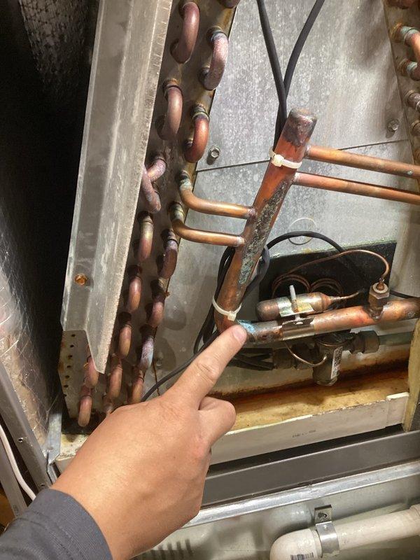 Performed air conditioning repair and boiler service on residential HVAC system. Confirmed low refrigerant condition in cooling system as previously diagnosed. Added 2 lbs of R410A refrigerant and UV dye to system for future leak detection and scheduled follow-up leak search. 

Inspected boiler and identified elevated carbon monoxide levels indicating improper combustion and ventilation. Cleaned burner assembly and lubricated inducer motor. Determined inducer motor is not functioning at optimal capacity, resulting in inadequate exhaust ventilation. Adjusted system to restore safe operating parameters and confirmed boiler returned to proper operation with acceptable combustion levels.