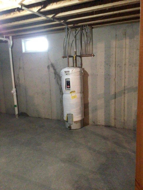 Completed comprehensive furnace tune-up on 4-5 year old gas unit operating within normal parameters. Cleaned flame sensor, performed electrical testing with all readings within manufacturer specifications, verified drainage hoses were clear, and confirmed proper temperature differentials across the heat exchanger. Air filter was found in new condition and required no replacement.