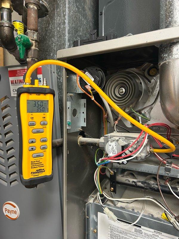 Completed comprehensive furnace and boiler tune-up maintenance visit in response to reported cricket-like noises from the boiler system. Performed full furnace inspection including thermostat operation, air filter condition, blower assembly, burner/heat exchanger compartment, inducer operation, ignition system, flame sensor, safety controls, electrical components, condensate drain, and temperature rise measurements. Cleaned flame sensor, cleared condensate drain line of debris, and cleared both pressure tube and condensation tube to ensure proper drainage and system operation. Inspected wall-mounted hydronic boiler system with Mini brand unit, verified pressure gauge readings, and documented system configuration including expansion tank, air separator, and copper piping network. All temperature and operational readings fell within normal operating range with no mechanical deficiencies or safety issues identified at this time. Advised customer to maintain monthly air filter replacement 