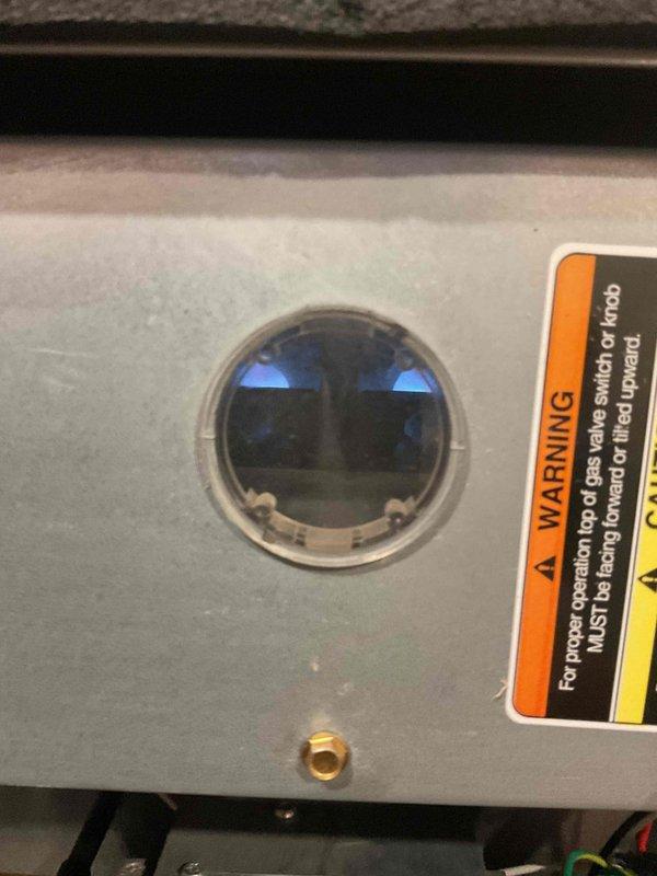 Completed scheduled HVAC maintenance tune-up on heating and cooling system with no reported issues or concerns. Performed standard inspection procedures, verified proper operation of furnace including pilot light and gas valve positioning through observation window, and documented system condition through photography. Recommended monthly filter replacement to maintain optimal system performance.