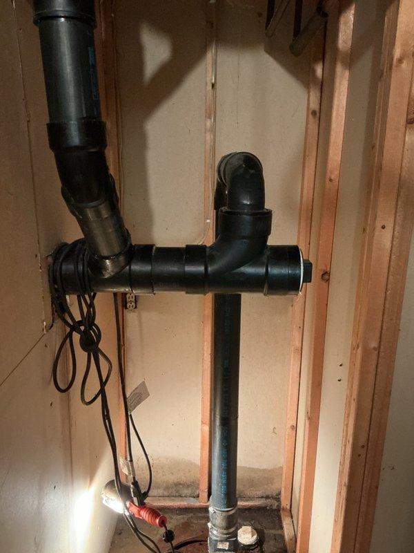 Responded to basement flooding complaint initially suspected to originate from upstairs shower. Upon investigation, determined the flooding was caused by sump pit overflow due to failed pump switch mechanism. Inspected sump pump system and confirmed switch malfunction preventing proper pump activation. Documented existing plumbing infrastructure including drainage piping and vertical steel piping penetrations. Submitted parts requisition for replacement pump switch to restore proper sump pump operation and prevent future basement flooding incidents.