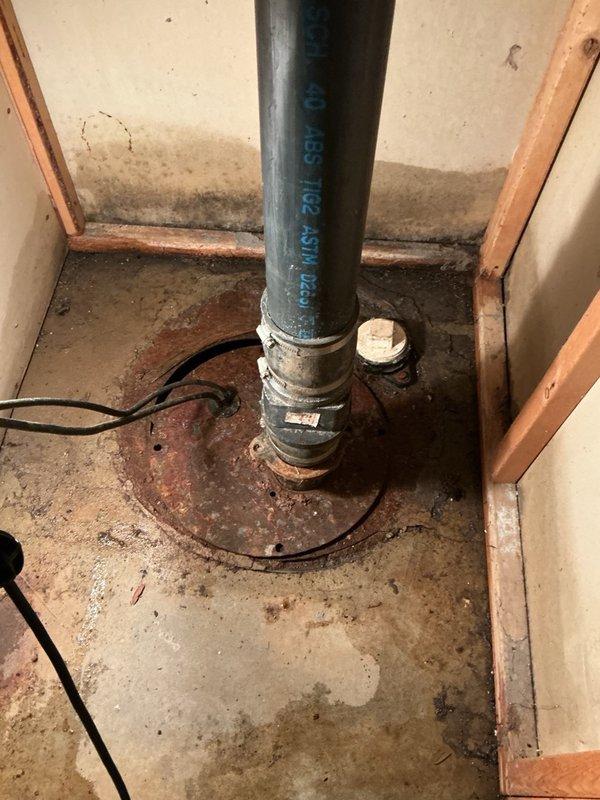 Responded to basement flooding complaint initially suspected to originate from upstairs shower. Upon investigation, determined the flooding was caused by sump pit overflow due to failed pump switch mechanism. Inspected sump pump system and confirmed switch malfunction preventing proper pump activation. Documented existing plumbing infrastructure including drainage piping and vertical steel piping penetrations. Submitted parts requisition for replacement pump switch to restore proper sump pump operation and prevent future basement flooding incidents.