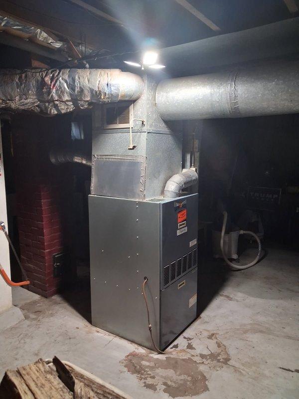 Performed comprehensive tune-up and maintenance on 30-year-old oil furnace system that was experiencing heating issues and emitting a hot or burning smell from vents upon initial startup. Conducted full system inspection, replaced burner nozzle, and performed combustion analysis to ensure proper fuel-to-air ratio and efficient operation. Removed small piece of insulation material that had fallen onto the top of the heat exchanger, which was likely the source of the burning odor. Verified all components of the Beckett oil burner assembly were functioning correctly, checked electrical connections, and confirmed proper operation of the heating system. Unit tested and left in good working order.