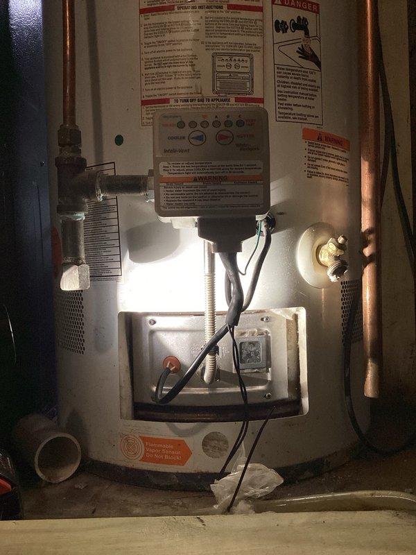 Responded to no hot water complaint on 2009 Rheem PowerVent natural gas water heater experiencing ignition failure. Unit would not maintain flame and burner would not light upon startup. Performed diagnostic testing including cleaning flame sensor, verifying vent system was clear and unobstructed, and testing pressure switch operation which confirmed proper function. Checked for spark at ignition but observed no spark generation throughout multiple attempts. Based on diagnostic findings, determined likely internal wiring failure within gas valve assembly preventing proper ignition sequence. Provided estimate for complete water heater replacement due to age of unit and cost-effectiveness of replacement versus repair of failed gas valve component.