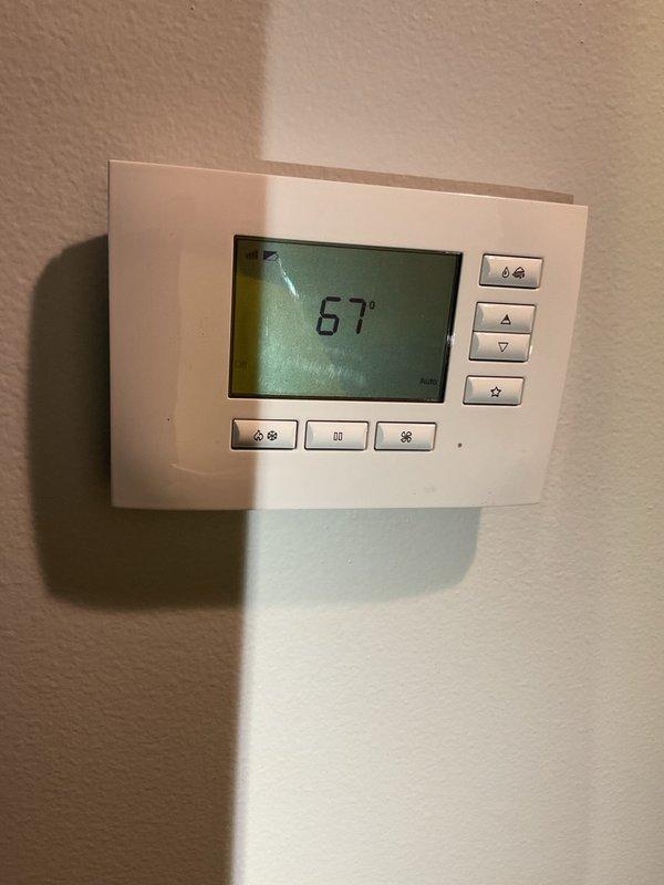 Responded to no-heat service call on 2015 furnace system. Upon inspection, discovered critical failures in primary heat exchanger with large breaches in two primary cells, suspected secondary heat exchanger leakage at drain openings above blower assembly, and condensate collector box leakage at bottom. Evidence of burner flame rollout observed due to compromised heat exchanger integrity. Homeowner had previously replaced igniter and flame sensor without resolving issue. Unit immediately tagged out as unsafe to operate per safety protocols due to potential carbon monoxide hazard from heat exchanger breaches. Performed diagnostic testing on air conditioning system using Job Link probes, which indicated low refrigerant charge contributing to reduced cooling efficiency and elevated energy consumption. Documented all findings with photographic evidence including thermostat display and ductwork conditions. Scheduled follow-up appointment for presentation of furnace replacement options and ai