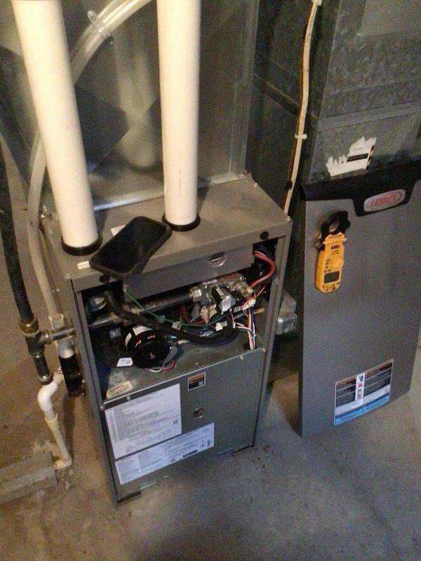 Completed comprehensive furnace tune-up on a residential unit less than 10 years old. Cleaned the flame sensor, performed electrical testing with all readings within manufacturer specifications, verified condensate hoses were clear and unobstructed, and confirmed proper operation including second-stage heating functionality. Unit is operating as designed with no issues identified.