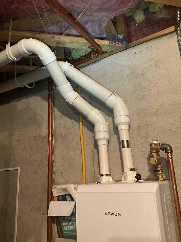 Completed annual maintenance inspection on two 18-year-old Bryant furnaces and one Navien boiler system. On both furnaces, verified ignition and flame safety operation, inspected burners and gas valves, confirmed heat exchangers in good condition, replaced air filters, checked humidifiers, inspected blower wheels, performed combustion analysis with satisfactory results, and verified temperature rise within manufacturer specifications. On the Navien boiler, inspected all piping connections, tested backflow preventer and pressure relief valve, verified system electronics and control operation, and performed combustion analysis with acceptable results. All equipment operating properly at time of service completion.