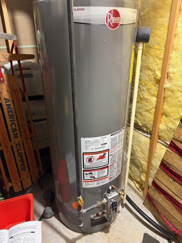 Responded to no hot water condition affecting entire house on Rheem Classic tanked water heater unit. Diagnosed faulty thermopile preventing proper pilot flame detection and gas valve operation. Replaced defective thermopile with new component, restored hot water functionality, and verified proper unit operation.