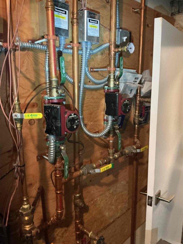Responded to no hot water complaint on NTI boiler system. Found Error 67 code indicating ILK switch failure to close, caused by tripped low water cutoff with system pressure at 10 psi. Refilled boiler to proper operating pressure of 20 psi, restoring system function. Unit fired successfully and resumed heating domestic hot water tank. Verified condensate trap drainage operating correctly and confirmed exhaust pathway clear of obstructions. Inspected all accessible piping for leaks with no issues found. Confirmed safe operation of all system components including circulation pumps, gas valve assembly, and safety controls. System restored to full operational status.