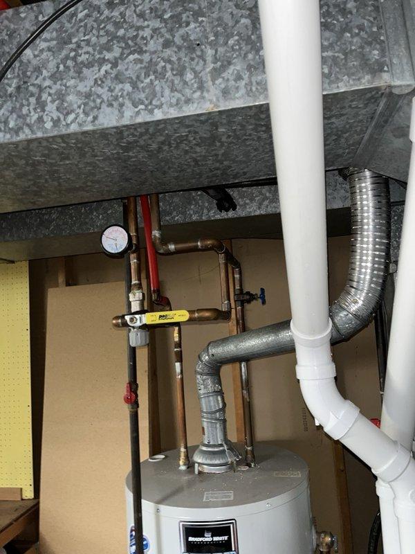 Responded to leaking laundry connections where outdated shower shutoff valves were failing at the hot and cold water supply lines for the washing machine. Removed the old defective valves and installed new boiler drains to provide reliable shutoff capability and eliminate the active leaks. System was tested and confirmed operational with no further leakage detected.