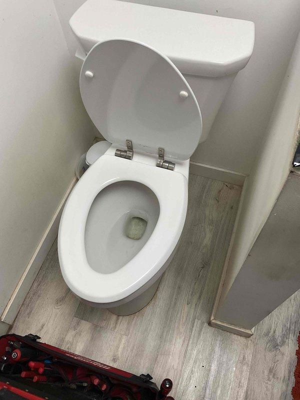 Responded to service call for toilet reset due to difficulty seating new wax ring. Upon inspection, discovered broken toilet flange preventing proper seal. Removed toilet, replaced damaged flange with new unit, and successfully reset toilet with proper wax ring seal to restore full functionality.