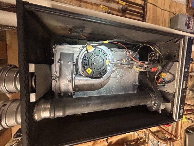 Performed comprehensive preventive maintenance on hydronic heating system and air handler as part of recurring maintenance agreement. Completed boiler tune-up including inspection of heat exchanger, cleaning of flame sensor, verification of zone operation, and condensate drain clearing. Monitored system through full heat cycle to confirm proper water pressure and expansion control. Conducted thorough inspection of air handler blower assembly, evaporator coil, and internal components. Verified air filter condition and overall system operation. All equipment found operating within normal parameters.