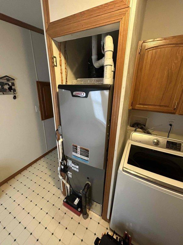 Completed comprehensive furnace tune-up on a 2-year-old Lennox gas furnace unit installed in residential utility closet. Performed standard maintenance protocol including inspection of all major components, burner assembly cleaning, filter evaluation, and safety system verification as documented on tuneup checklist.