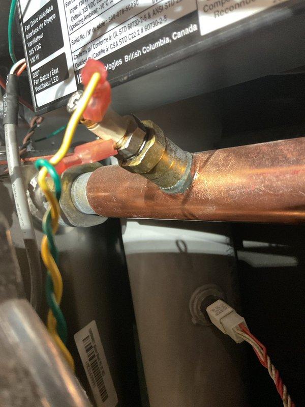 Responded to service call for boiler making unusual "mooing" noise after system was switched from geothermal to boiler heating mode. Ran boiler for approximately 20 minutes but did not observe the reported noise; suspected moisture on burner caused temporary dirty combustion that has since resolved. During inspection, discovered low water cutoff safety control was triggering and causing system alarm. Cleaned low water cutoff and added water to boiler, but safety control continued to alarm, indicating component failure requiring replacement. Ordered replacement low water cutoff and ignition module board as precautionary measure. Tested geothermal system operation and confirmed proper function. Additional boiler cleaning in garage required upon return visit to complete work with ordered parts installation.