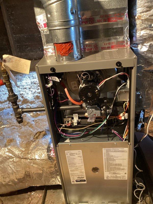 Completed warranty service on two newly installed HVAC systems experiencing multiple operational issues. First level basement furnace exhibited ignition problems, potentially related to weak hot surface ignitor or flame sensor; resolved thermostat issue where unit was not properly secured to wall, restoring heat functionality. Identified critical electrical hazard with GFCI outlet wired at 240V instead of proper voltage, requiring licensed electrician for correction. Outdoor unit lacks power at disconnect switch despite indoor breaker being energized, indicating wiring fault requiring electrical contractor attention.

Second level system experiencing rapid cycling due to high pressure condition. Recovered 9 pounds of refrigerant with recovery tank reaching capacity; approximately 2 additional pounds remain in system. Manufacturer nameplate indicates 5-pound factory charge, but 4 pounds were recovered beyond factory amount, suggesting overcharge condition. System requires complete refri