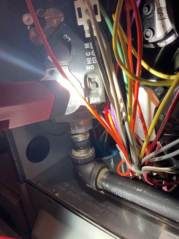 Responded to no-heat callback on recently installed furnace. Upon inspection, discovered both the external gas shutoff valve and the furnace gas valve switch were in the OFF position. Restored gas supply at both locations and verified normal heating operation. Unit produced significant startup smoke upon initial firing, activating smoke alarms, indicating residual manufacturing oils or possible lack of operational verification during original installation. Documented control board wiring and external gas meter assembly. System now operating normally with proper heat output.