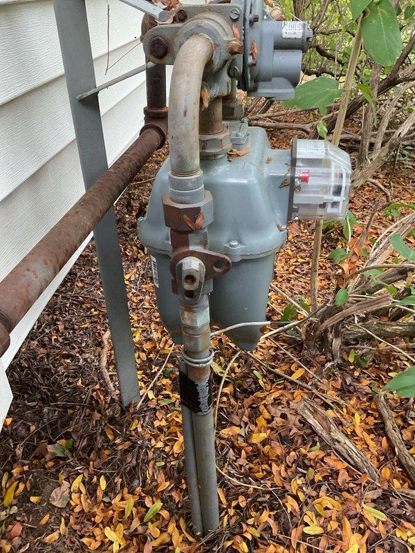 Responded to no-heat callback on recently installed furnace. Upon inspection, discovered both the external gas shutoff valve and the furnace gas valve switch were in the OFF position. Restored gas supply at both locations and verified normal heating operation. Unit produced significant startup smoke upon initial firing, activating smoke alarms, indicating residual manufacturing oils or possible lack of operational verification during original installation. Documented control board wiring and external gas meter assembly. System now operating normally with proper heat output.