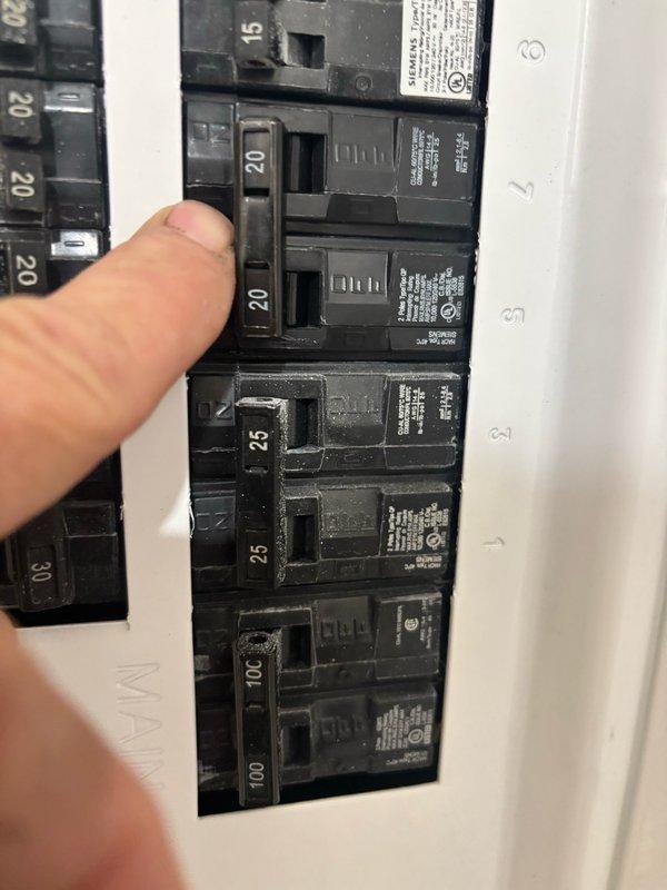Responded to HVAC install callback to correct improperly sized circuit breaker. Replaced existing 25-amp breaker with correct Siemens QP 20-amp 2-pole breaker per specifications and code requirements. Documented installation with photographs for inspector approval. During system verification, detected natural gas odor at gas meter, investigated and identified leak on utility company side of meter. Advised property contact to report gas leak to utility provider immediately for emergency repair.