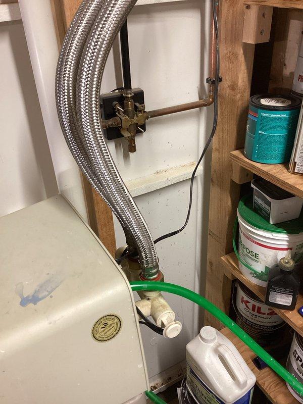Responded to service call for Morton System Saver water softener experiencing continuous discharge and cycling malfunctions. Upon arrival, found unit displaying error code with brine tank half full and softener stuck in regeneration cycle, resulting in ongoing water waste. Diagnosed failed control valve assembly preventing proper cycle completion. Bypassed softener system to immediately stop water discharge and prevent further water loss. Documented equipment condition with photos showing unit installation, plumbing connections, and salt reservoir status. Recommended complete softener replacement due to control valve failure and age of unit.