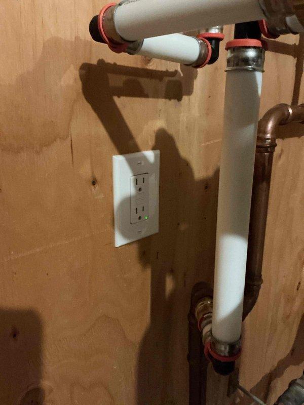 Responded to no hot water complaint on residential tanked water heater approximately 5 years old. Upon arrival, diagnosed electrical issue with GFCI outlet supplying power to water heater. Found GFCI breaker tripped at outlet serving the unit. Reset GFCI button to restore power to water heater. Verified proper electrical supply restored and unit operational. Customer concern regarding extended wait time for hot water delivery noted as secondary issue related to distance from water heater to fixtures rather than equipment malfunction.