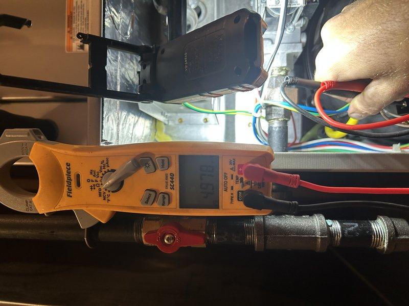 Completed comprehensive furnace tune-up and maintenance inspection on residential heating unit. Performed operational testing with temperature rise measurements confirming system within manufacturer specifications. Adjusted gas pressure to optimal 3.5 inches water column for proper combustion efficiency. Inspected and tested blower motor capacitor using digital clamp meter, verifying electrical readings within normal parameters. Cleaned flame sensor and inspected hot surface igniter for proper operation. Cleared condensate drain line to ensure proper drainage. Verified air filter and blower compartment cleanliness. All components tested and confirmed operating correctly with no deficiencies noted.