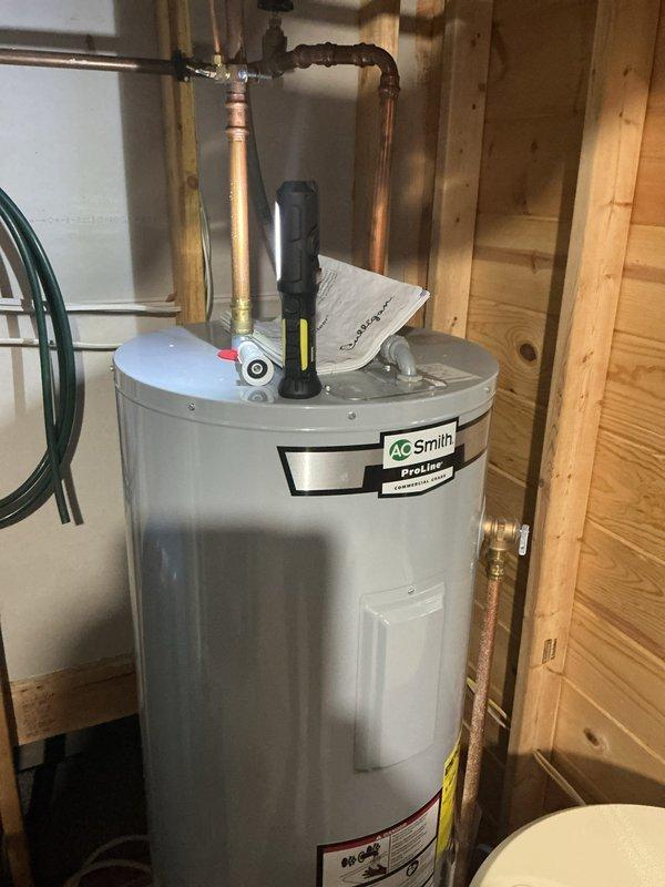 Responded to complaint of air in water lines on well system. Performed diagnostic inspection of pressure tank, water softener, and associated plumbing connections. Identified air entrainment most likely originating from Culligan water softener brine tank malfunction. Pressure tank and well system components found to be functioning within normal parameters. Recommended repiping to address chronic air infiltration issues and advised customer to contact Culligan for service on water treatment system to resolve brine tank problem causing air introduction into water supply lines.