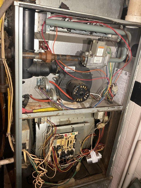 Performed comprehensive seasonal tune-up on a Ruud 90+ efficiency furnace approximately 10 years old. Completed full maintenance protocol including inspection of control board with all relays, LED indicators, and electrical connections functioning properly, verified burner assembly operation, checked blower motor performance, tested gas valve operation, and inspected all wiring harnesses and safety controls. All components found to be in good working condition with unit operating within manufacturer specifications.