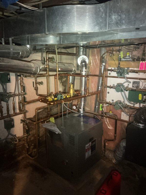Performed scheduled maintenance inspection on 5-month-old boiler system and associated hydronic heating manifold. All equipment found to be operational with proper zone valve function, manifold controls responding correctly, and copper piping connections secure throughout the multi-zone heating system.