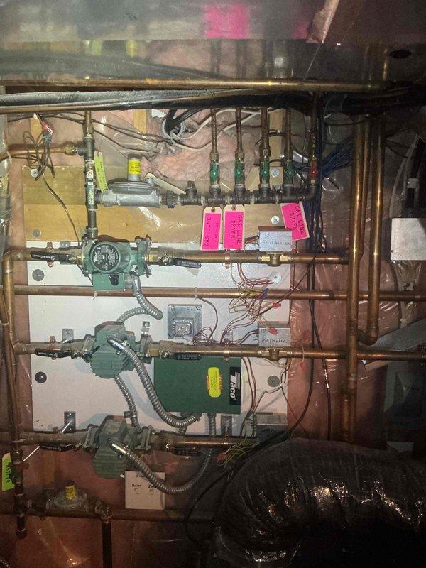 Performed scheduled maintenance inspection on 5-month-old boiler system and associated hydronic heating manifold. All equipment found to be operational with proper zone valve function, manifold controls responding correctly, and copper piping connections secure throughout the multi-zone heating system.