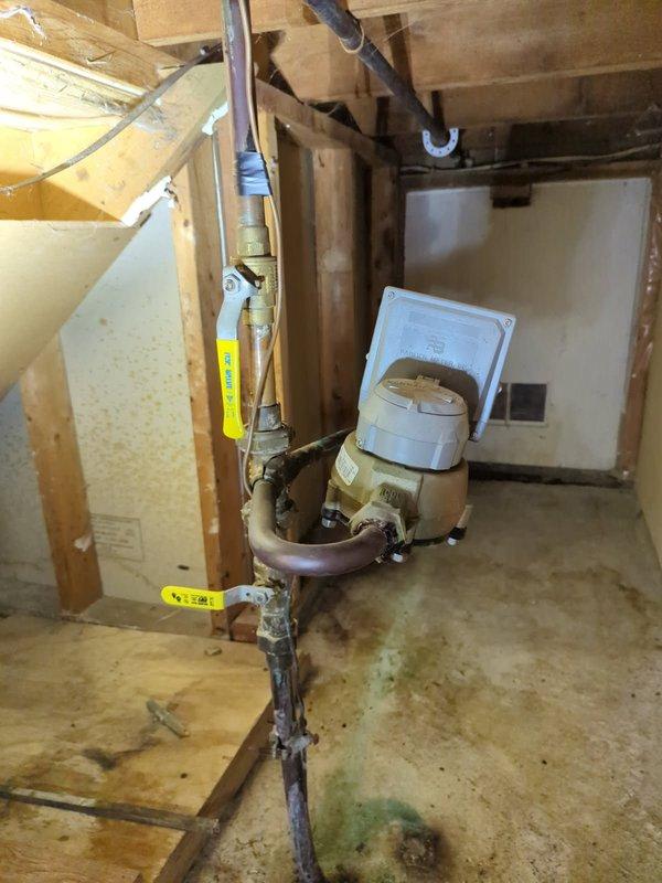 Responded to emergency main line break with active water leak at the meter assembly. Upon arrival, confirmed leak was originating from the connecting valve attached to the water meter. Immediately shut off water supply to the residence to prevent further water damage and flooding. 

Customer had already procured a new meter horn for replacement. Removed the failed connecting valve from the existing meter assembly. Installed the new meter horn with proper connections to ensure secure, leak-free operation. Verified all pipe connections were properly seated and tightened to manufacturer specifications. Restored water service to the property and performed pressure testing to confirm the repair eliminated the leak. Inspected surrounding plumbing infrastructure including copper supply lines and shutoff valves for any additional concerns. Left the meter assembly fully operational with no active leaks detected. Cleaned work area and ensured all debris from the repair was removed from the premi
