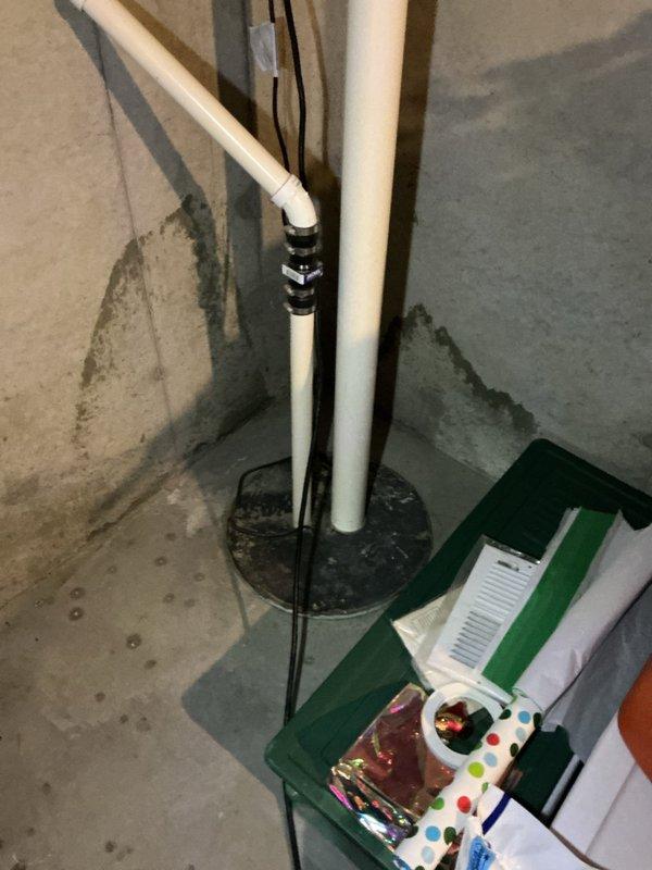 Responded to emergency water main leak at owner-occupied residential property built in 2021. Upon arrival, coordinated with River Falls utility company to shut off water at the curb stop, as the home had no water supply due to a failed ball valve. Inspection revealed the main isolation ball valve serving the entire home had split and required immediate replacement.

Removed the damaged ball valve assembly and installed a new brass ball valve with red handle to serve as the primary whole-home shutoff. Utilized proper thread seal tape on all connection points to ensure leak-free joints. Connected the new valve assembly between the existing copper supply line from the water main and the white PVC distribution piping serving the residence. Installed appropriate brass fittings and elbows to maintain proper configuration and flow direction.

After installation was complete, coordinated with River Falls to restore water service at the curb stop. Tested the new ball valve for proper operation 