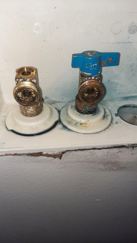 Responded to active water leak at residential property where hot water shut-off valve had broken off and cold water valve was also leaking, resulting in loss of hot water supply to the home. Upon arrival, found homeowner had already shut off main water supply to prevent further damage. Removed failed brass shut-off valves showing significant corrosion and age-related deterioration. Installed new ball valve shut-offs with lever handles to restore proper water control and functionality. Also replaced washer supply shut-off valves as part of the repair. All new valves tested and confirmed operational with no leaks detected. Water supply restored to residence.