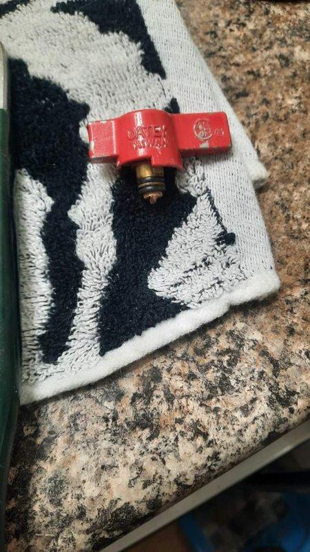 Responded to active water leak at residential property where hot water shut-off valve had broken off and cold water valve was also leaking, resulting in loss of hot water supply to the home. Upon arrival, found homeowner had already shut off main water supply to prevent further damage. Removed failed brass shut-off valves showing significant corrosion and age-related deterioration. Installed new ball valve shut-offs with lever handles to restore proper water control and functionality. Also replaced washer supply shut-off valves as part of the repair. All new valves tested and confirmed operational with no leaks detected. Water supply restored to residence.