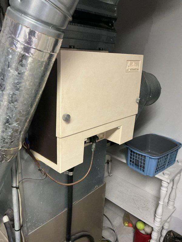 Responded to no heat call on 22-year-old furnace. Upon arrival, discovered thermostat wiring issue from recent summer replacement—W and C wires were reversed. Corrected wiring and furnace initiated startup sequence. During operational inspection, identified blower motor actively leaking lubricating oil. Further diagnostic revealed multiple cracks in heat exchanger with carbon monoxide leakage detected outside the combustion chamber during operation. Tagged unit as unsafe and shut down system immediately due to life safety hazard. Furnace replacement estimate scheduled due to age of equipment and extent of critical component failures making repair economically unfeasible.