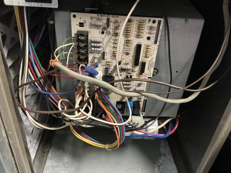 Responded to no heat call on 22-year-old furnace. Upon arrival, discovered thermostat wiring issue from recent summer replacement—W and C wires were reversed. Corrected wiring and furnace initiated startup sequence. During operational inspection, identified blower motor actively leaking lubricating oil. Further diagnostic revealed multiple cracks in heat exchanger with carbon monoxide leakage detected outside the combustion chamber during operation. Tagged unit as unsafe and shut down system immediately due to life safety hazard. Furnace replacement estimate scheduled due to age of equipment and extent of critical component failures making repair economically unfeasible.