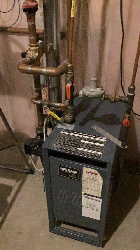 Responded to service call for emergency shut-off valve installation consultation to prevent potential flooding when property is unoccupied. Conducted comprehensive assessment of existing plumbing infrastructure, including water treatment system with dual filtration tanks, boiler unit, and associated copper piping network. Provided detailed estimates for emergency shut-off valve installation, whole-home water sensor system, and complete residential repipe of aging plumbing components. Documented existing conditions with photographs showing current water filtration setup, heating system connections, and copper supply lines exhibiting normal wear patterns. Customer requested same-day installation capability for emergency shut-off valve to address immediate concerns about unattended water damage risk.