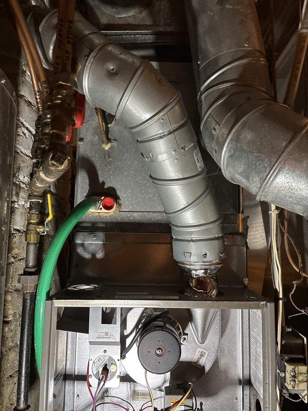 Performed second opinion inspection and maintenance on 13-year-old furnace system. Verified heat exchanger showing significant deterioration with rust and temperature stress damage requiring attention. Identified blower motor capacitor reading out of manufacturer specifications. Conducted combustion analysis confirming proper burner operation and gas combustion efficiency within acceptable parameters. Inspected and verified operational status of thermostat, air filter, condensate drain, blower motor, inducer motor, and electrical wiring connections. Measured temperature split across heat exchanger within normal range. Discussed findings and replacement options with homeowner and scheduled service advisor consultation for system replacement recommendations.