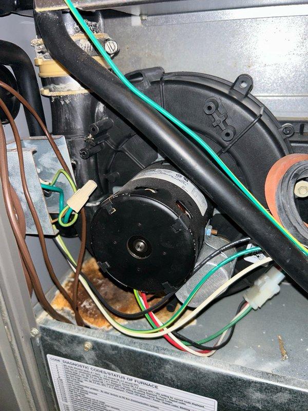 Completed comprehensive furnace tune-up on family rewards membership agreement, including inspection and cleaning of flame sensor, ignition assembly, blower wheel, air filtration system, inducer motor, gas valve, and heat exchanger with video scope—all components found in satisfactory condition. Performed combustion analysis confirming 95.6% system efficiency with safe carbon monoxide levels and proper gas pressure. Cleared condensation drain trap of buildup to ensure proper drainage. Homeowner reported temperature inconsistencies on upper floor with warmer conditions in summer and cooler conditions in winter; requested quote for supplemental inline duct booster fan to improve airflow to second level, noting existing 4x12 ductwork and previous fan speed adjustments. Documented equipment condition with photos of blower motor assembly, internal wiring, and cabinet components. Completed parts request form for customer quote on airflow enhancement solution. System operating within normal p