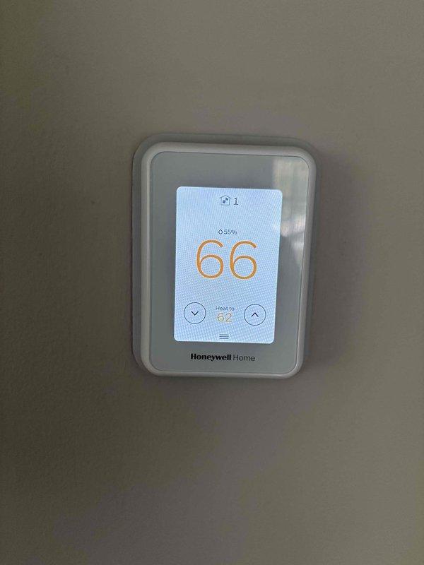 Completed scheduled maintenance agreement heating visit on a 2-year-old residential HVAC system consisting of one furnace and one humidifier. Performed comprehensive inspection of thermostat operation, air filter condition, condensate drain, blower motor, inducer motor, capacitor, and all electrical wiring connections—all components found in satisfactory condition. Evaluated temperature split across the system and confirmed proper performance parameters. Conducted thorough examination of furnace heat exchanger for cracks or deterioration, tested igniter and flame sensor functionality, and measured gas pressure at manifold. Adjusted gas pressure to manufacturer specifications to ensure optimal combustion efficiency and safe operation. Inspected humidifier operation, verified water panel condition, and confirmed proper drainage function. Homeowner supplied replacement water panel for installation during service visit. All systems tested and verified to be operating within normal paramete