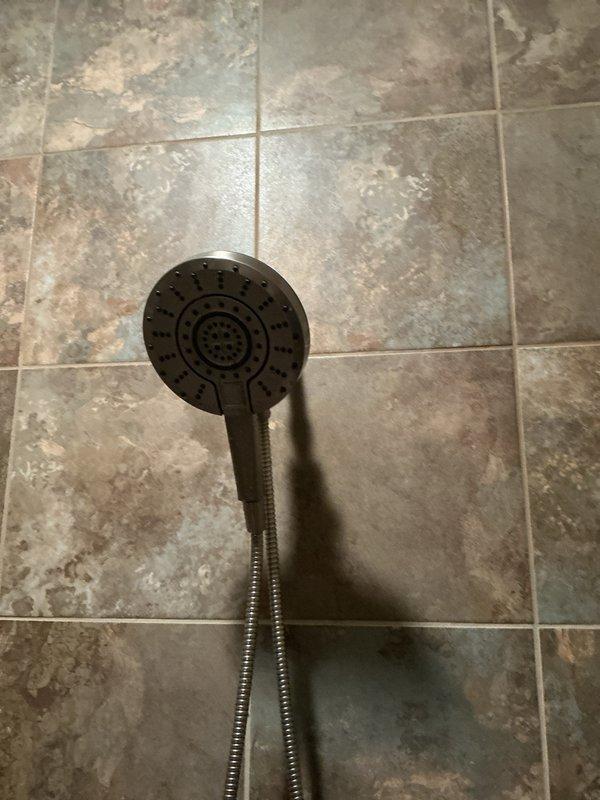 Responded to service call for dripping shower head and leaking sink faucet. Successfully replaced Kohler cartridge in shower valve, resolving the shower head leak. Attempted cartridge replacement in Kohler lavatory faucet but cartridge could not be extracted due to corrosion or mechanical binding. Recommended full faucet replacement for permanent resolution of sink leak.