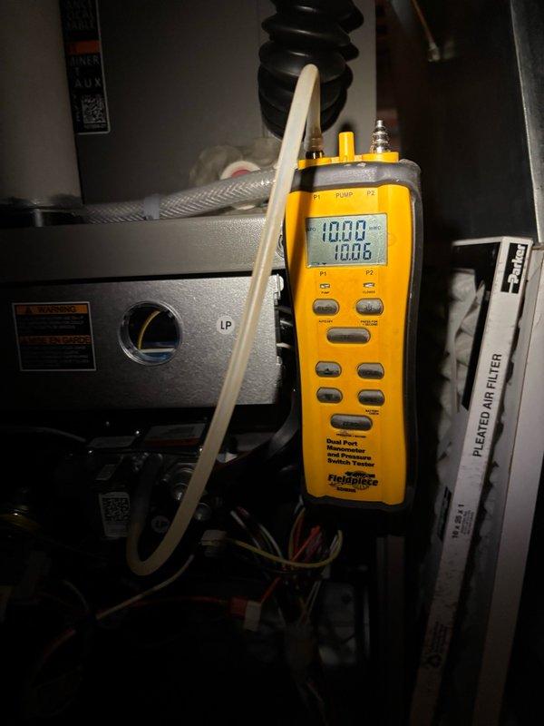 Completed startup and commissioning of LP gas furnace installation. Performed diagnostic testing using digital manometer to verify proper gas pressure readings at manifold, confirming system operating within manufacturer specifications. Verified all electrical connections, tested ignition sequence, and confirmed proper airflow through pleated air filter assembly. System operational and left in service.
