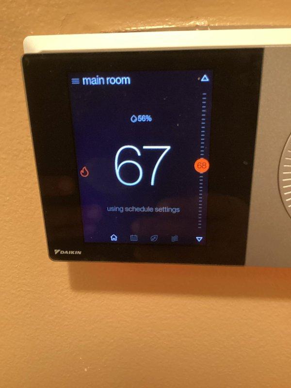 Responded to service call for heating system unable to maintain temperature below 77°F and Daikin thermostat experiencing screen freezing, slow response, and Wi-Fi connectivity issues. Performed complete thermostat reboot, established internet connection, and successfully downloaded and installed firmware update to resolve performance issues. System restored to proper operation with thermostat now responsive and connected to network.