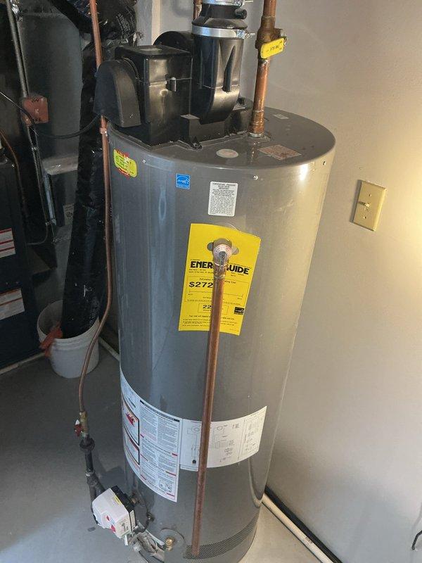 Responded to emergency call for leaking water heater. Upon arrival, found water actively leaking from the bottom of the existing 40-gallon power vent water heater tank, indicating internal tank failure requiring immediate replacement. Water supply to the unit was shut off to prevent further water damage.

Removed the failed 40-gallon power vent water heater from the installation location. Installed new Bradford White 40-gallon power vent water heater as replacement unit. Connected new water heater to existing copper water supply lines with appropriate fittings and shut-off valves. Made gas line connection to burner assembly using existing gas supply piping. Connected power vent exhaust system to existing ventilation ductwork to ensure proper combustion gas venting.

Restored water supply and gas supply to the new unit. Performed complete system startup and operational testing. Checked all water connections for leaks under pressure. Verified proper gas combustion and burner operation. C