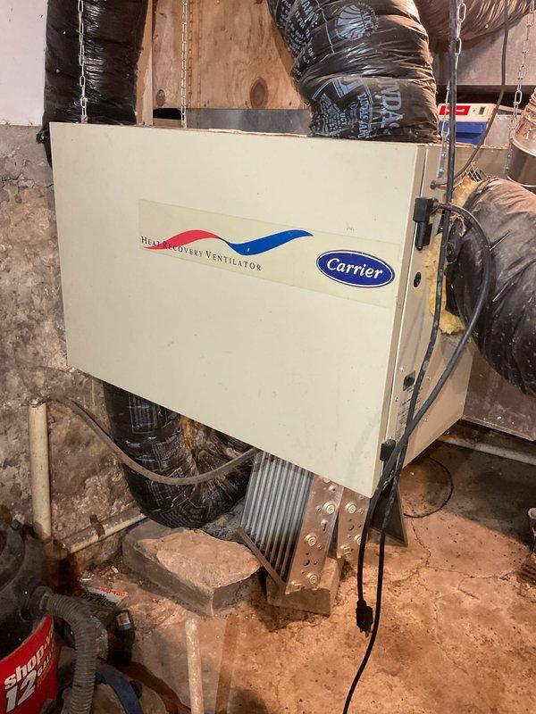 Completed preventive maintenance tuneup on geothermal heating and cooling system. Inspected and tested all system components, verified refrigerant pressures and operating temperatures were within manufacturer specifications, and confirmed unit functioning properly. Identified non-operational Carrier heat recovery ventilator and humidifier that require removal. Customer reported mold growth on interior surfaces, likely due to excessive indoor humidity levels and inadequate air circulation. Recommended installation of standalone whole house dehumidifier in basement with dedicated return air duct connection to work in conjunction with continuous fan operation on geothermal system to address moisture issues throughout home. Gathered equipment information for account records and advised customer on proper filtration requirements for system. Customer to schedule follow-up appointment for dehumidifier installation estimate and removal of non-functional ventilation equipment.
