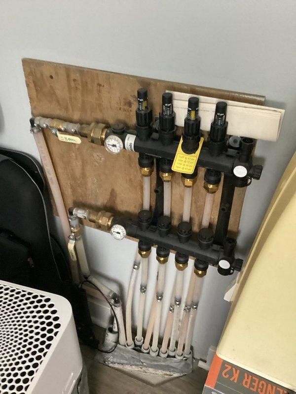 Responded to service call for in-floor radiant heating system with reported low boiler water pressure and concerns about potential system leaks. Upon arrival, confirmed boiler was operating below optimal pressure. Performed comprehensive system inspection including heat exchanger, ignitor, circulation pump, and radiant floor manifold distribution system. 

Purged air from multiple in-floor heating loops at the manifold and restored system water pressure to 17 psi. Conducted camera inspection of heat exchanger to check for internal leaks or damage. Performed full combustion analysis including gas inlet pressure, manifold pressure, and combustion air verification. Inspected all safety controls including pressure switches, limit switches, flame sensor, and igniter for proper operation. Checked blower motor, inducer motor, and venting system for proper exhaust flow and clearances.

Cycled boiler through multiple heating calls on both high and low fire to verify consistent ignition, flame c