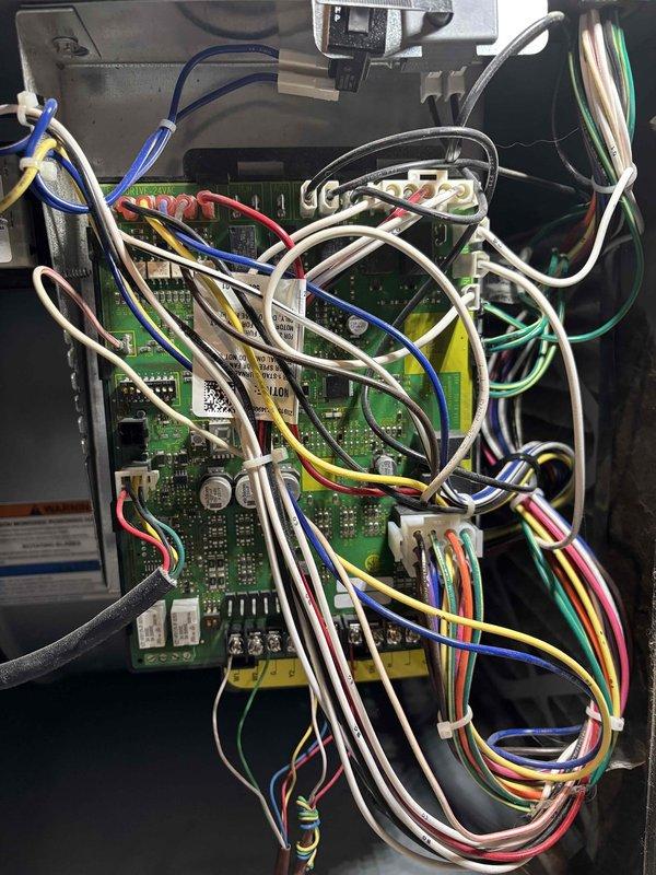 Completed warranty repair by replacing furnace control board with updated A2L-compatible connections. Removed existing control board and installed new board with proper A2L refrigerant compatibility. Verified system operation in both heating and cooling modes, confirming all connections secure and functionality restored. System is operating normally with no issues detected at time of completion.